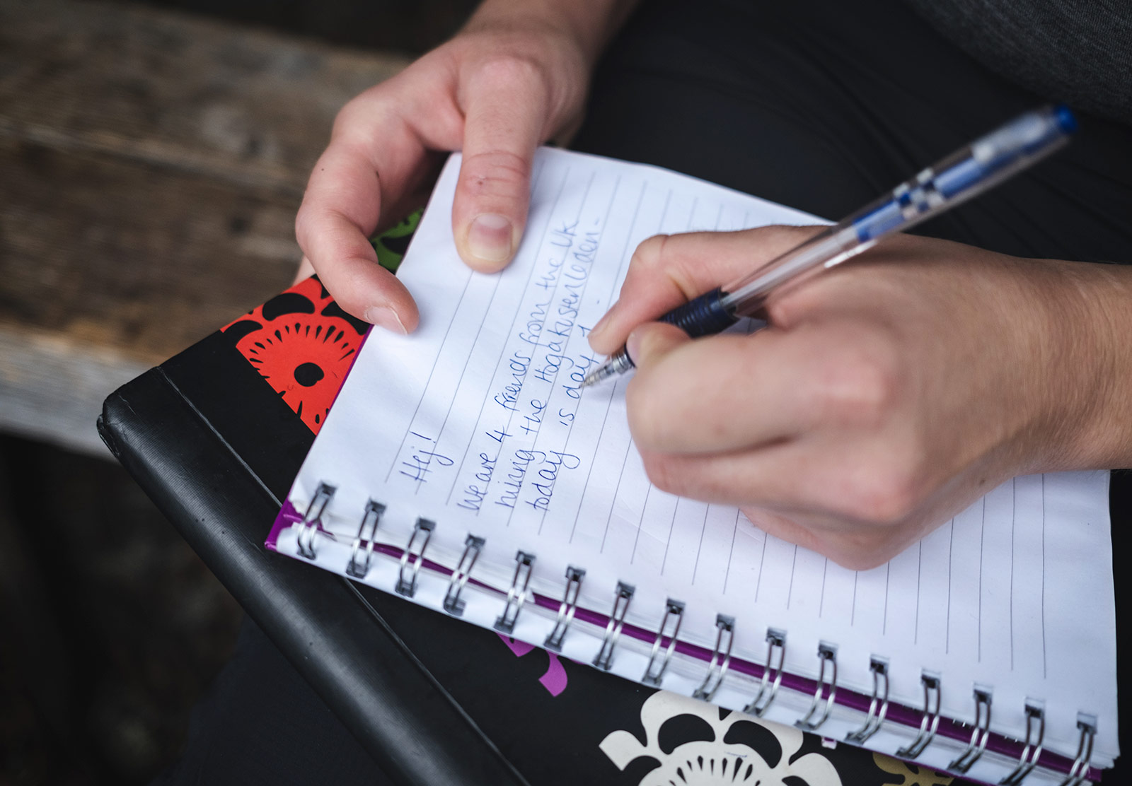 Person writing in guestbook