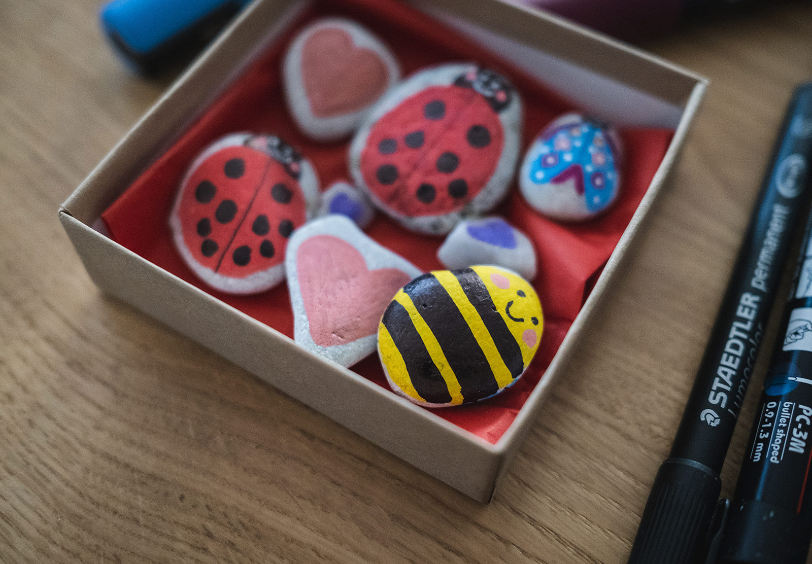 Box of painted rocks