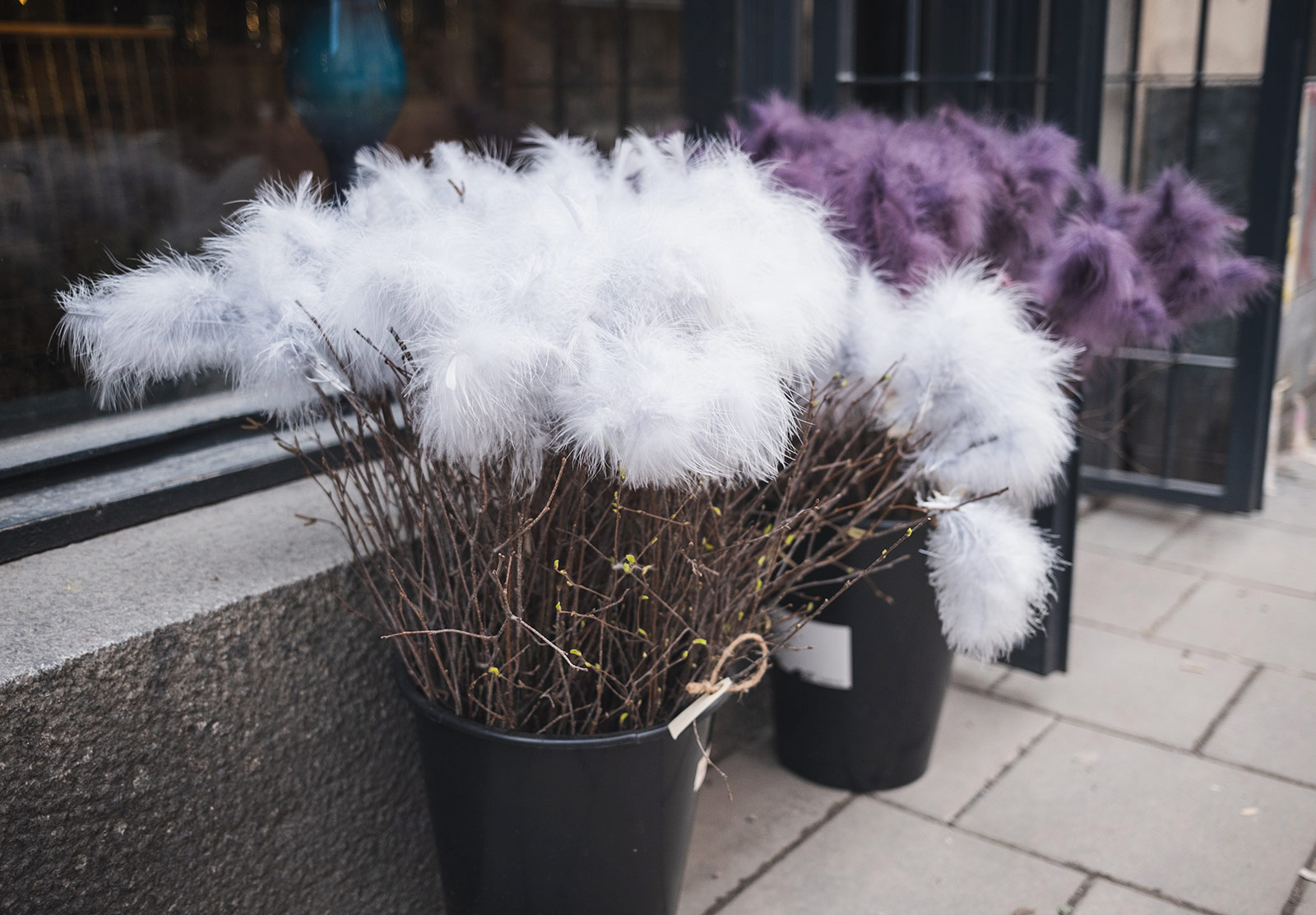 Colourful feathers in buckets