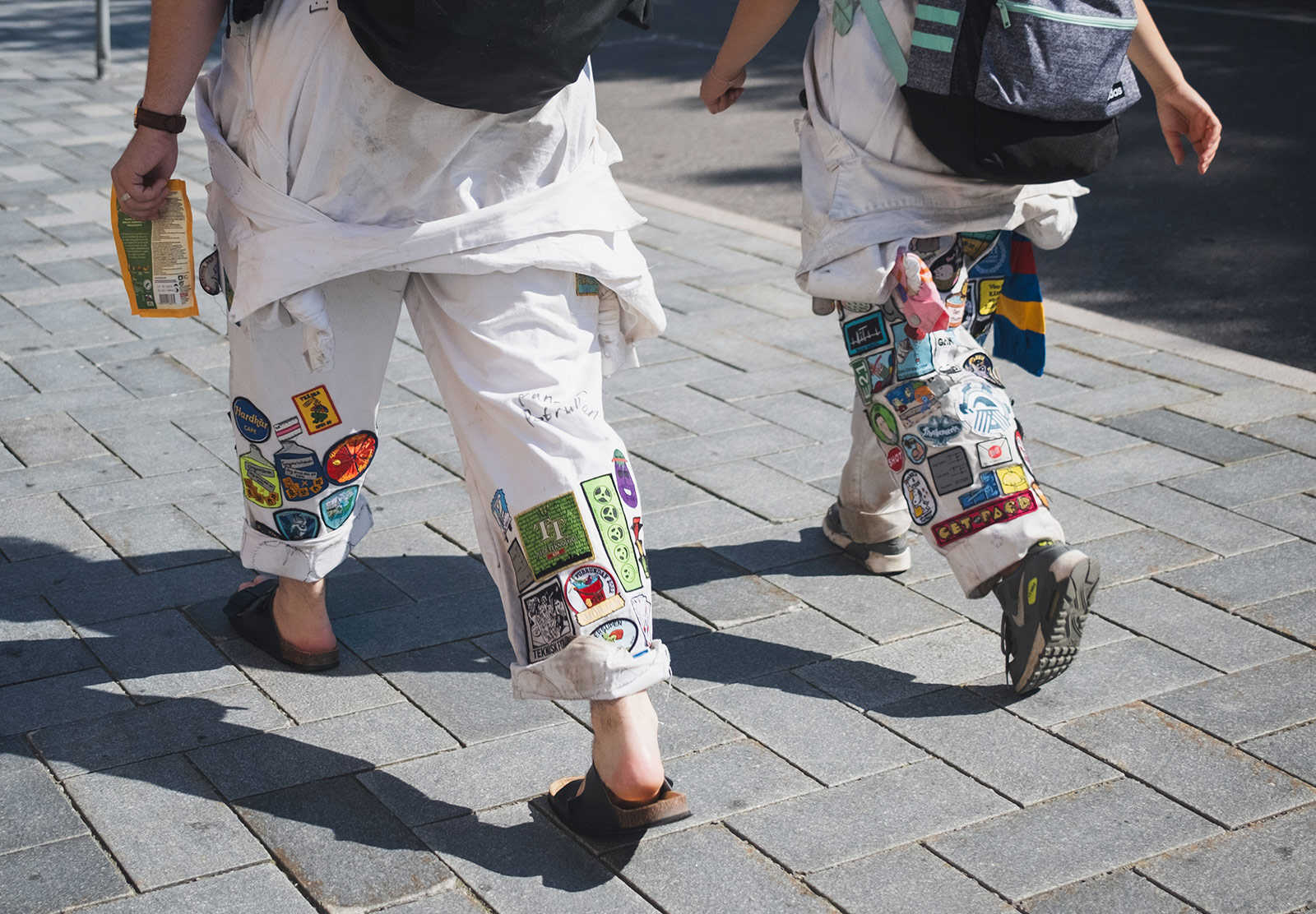Trousers with patches sewn on