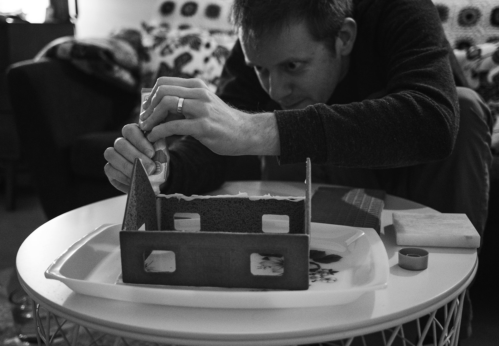 Man making gingerbread house