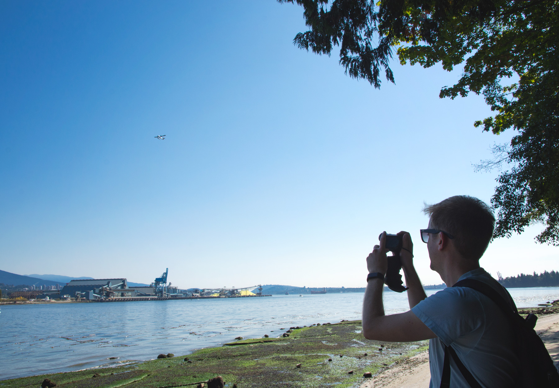 Man photographing seaplane