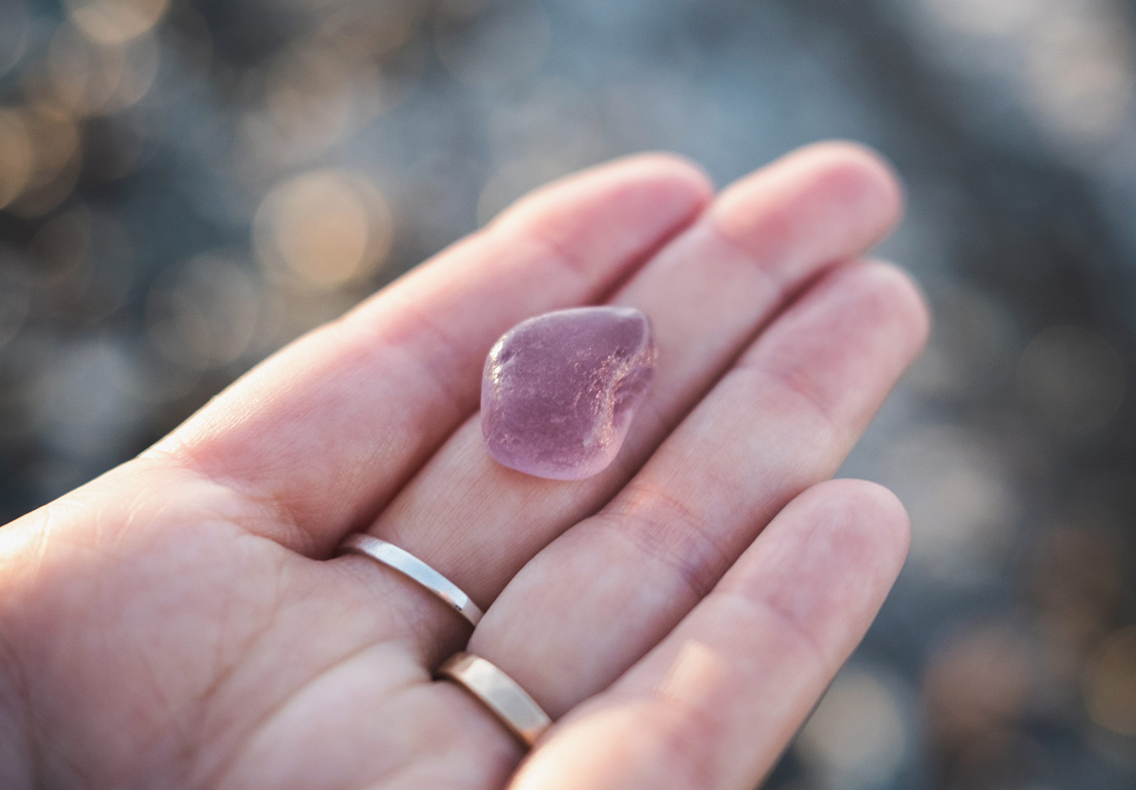 Smooth pink glass in hand