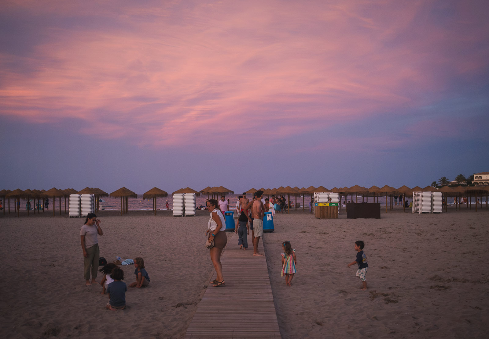 People on beach at sunset