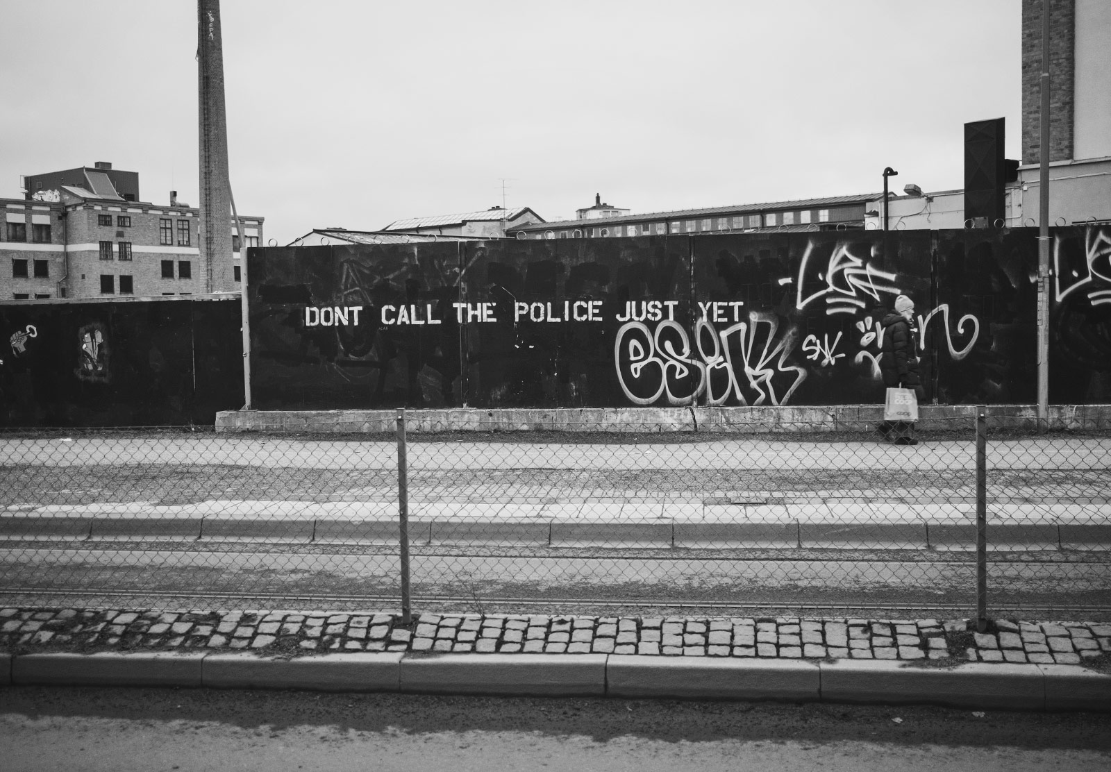 "Don't call the police just yet" graffiti