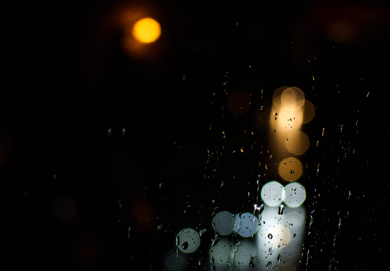 Lights through rain on window