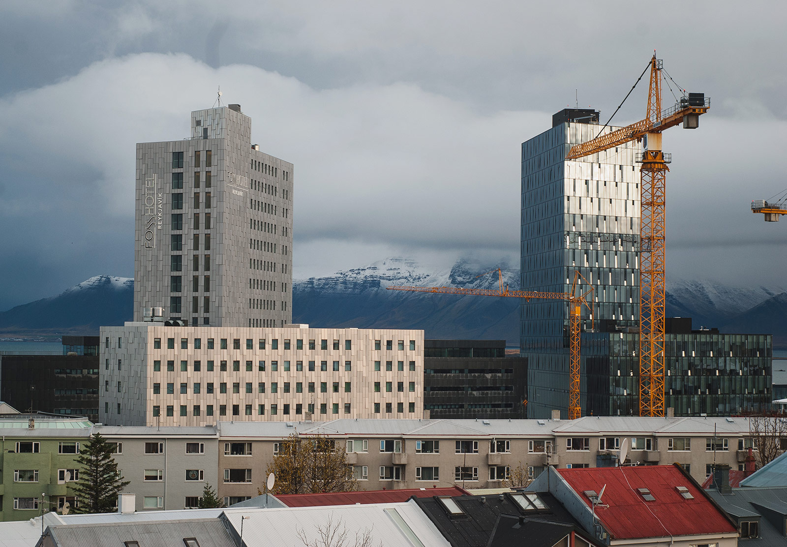 Tall buildings against mountains