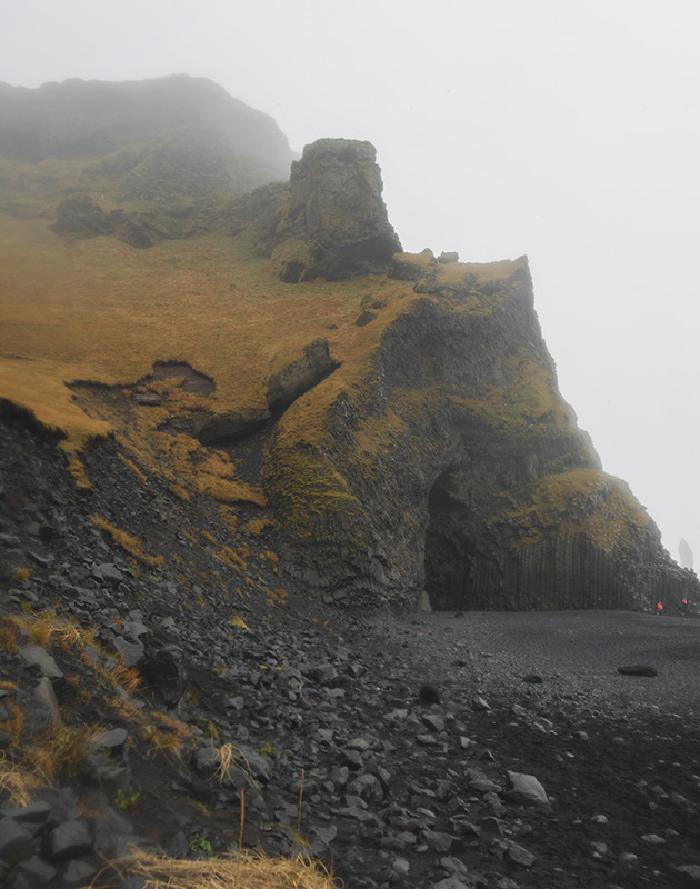 Cave on black sand beach
