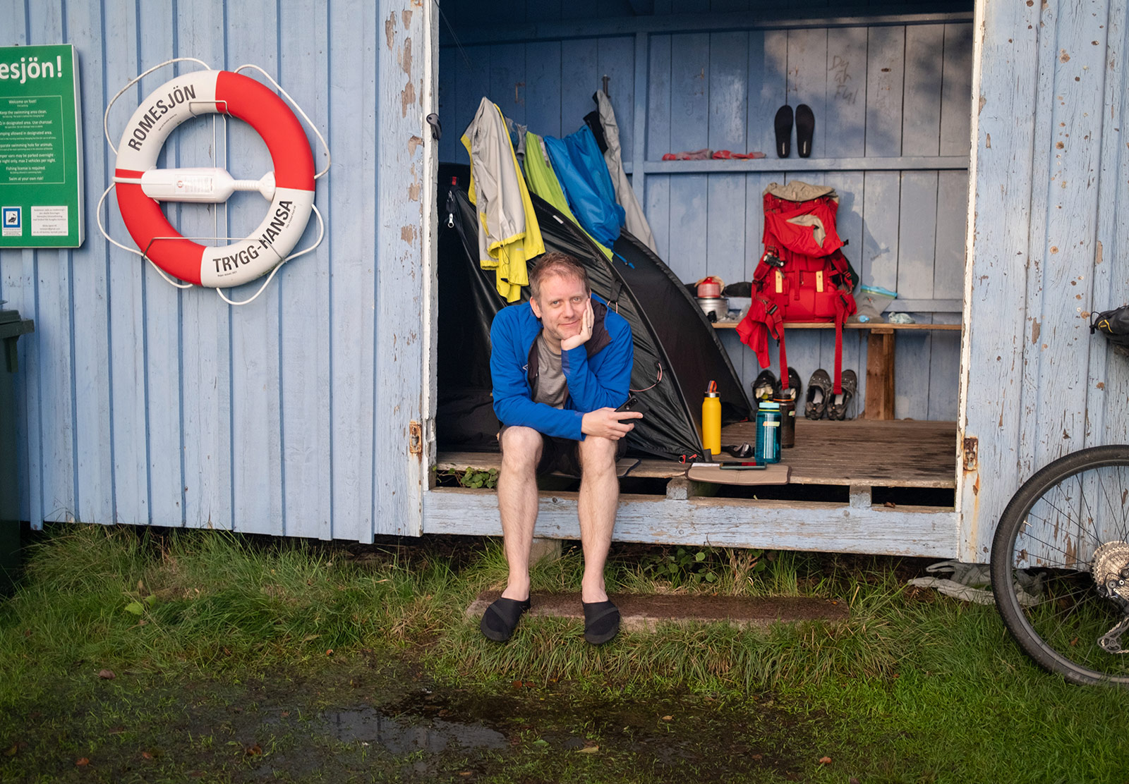 Man sat inside wind shelter