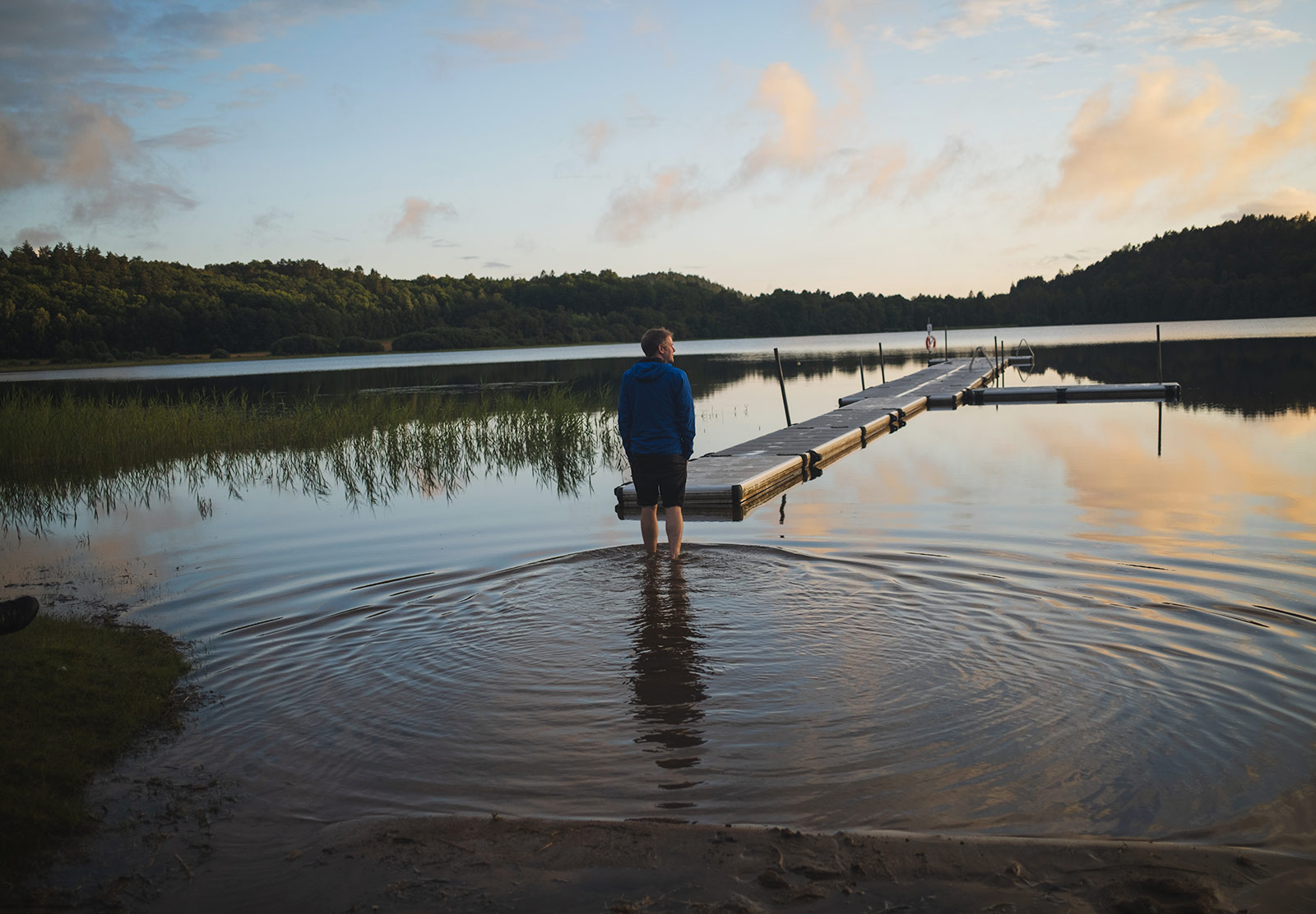 Man wading out into a lake