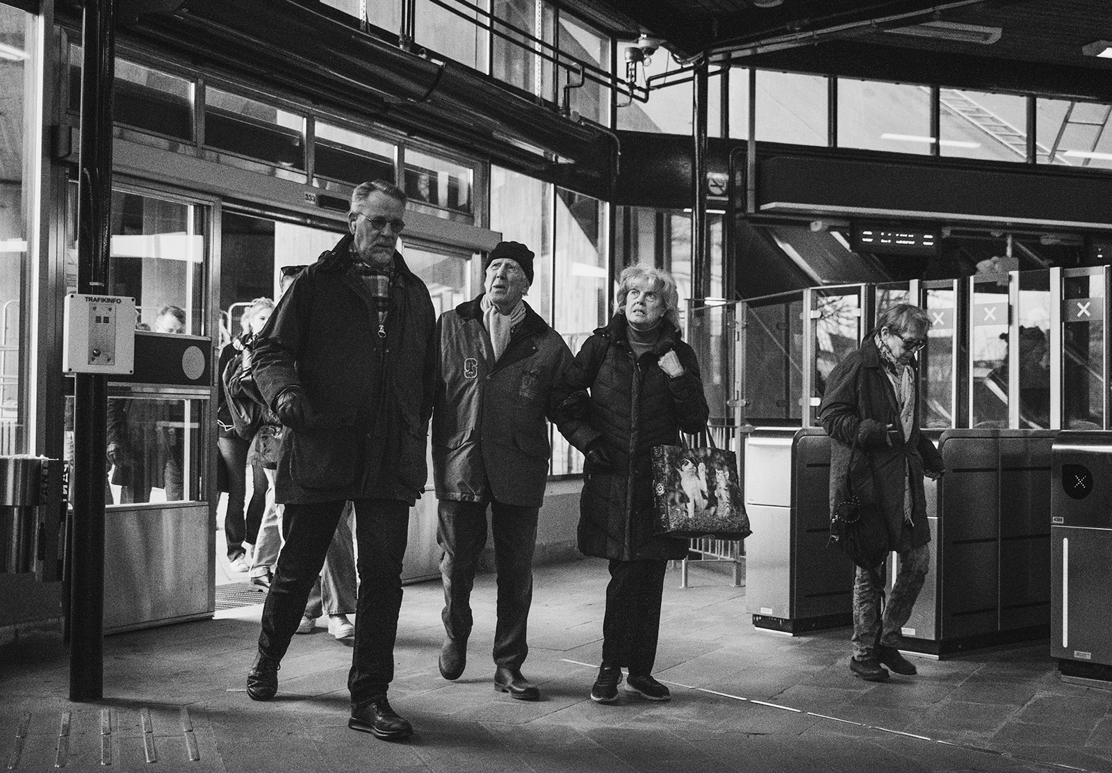 People passing through train station
