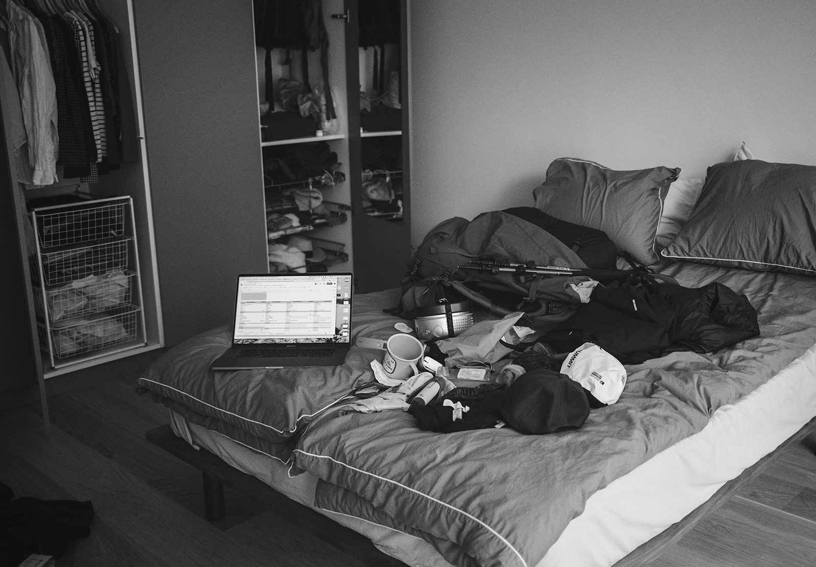 Bed covered in hiking items