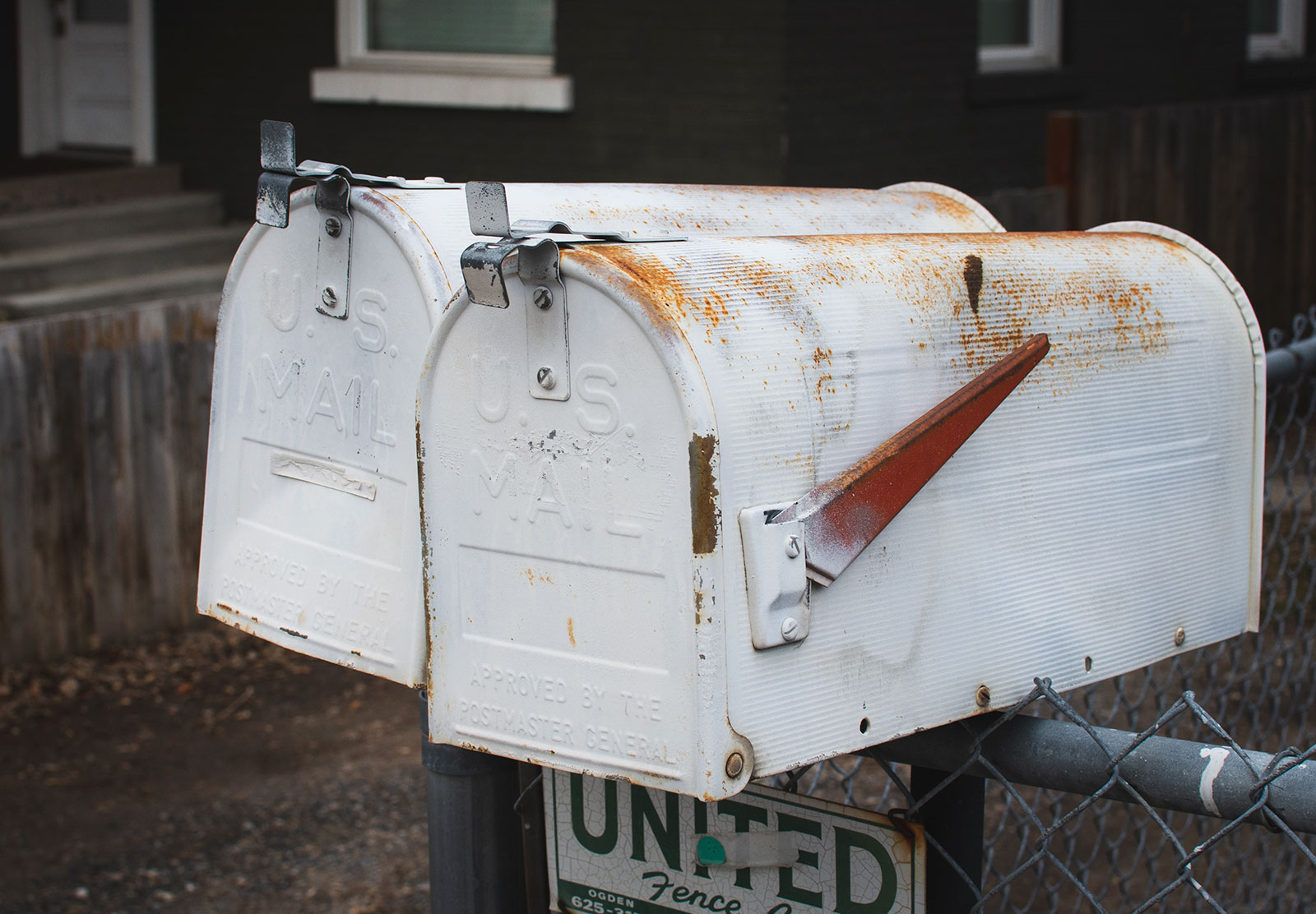 Rusty white mailbox