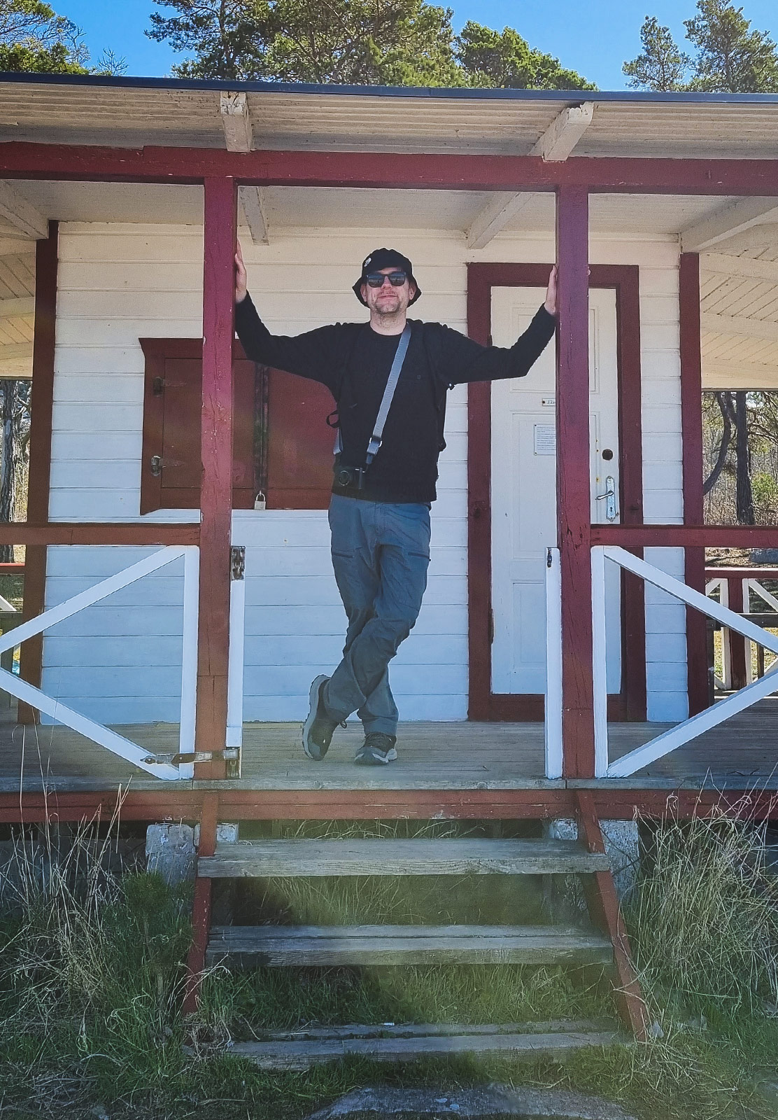 Man stood on cabin veranda