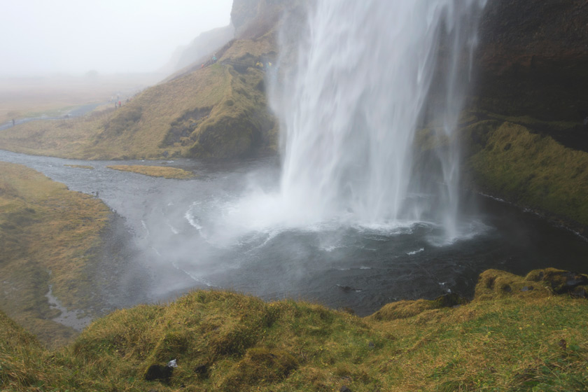 View behind waterfall