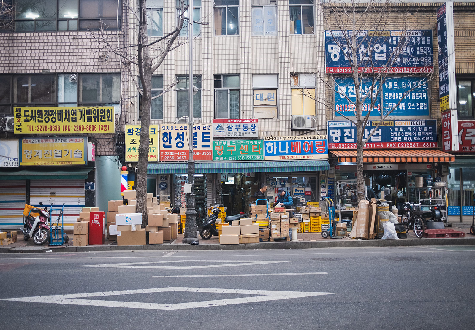 Boxes on pavement outside a shop
