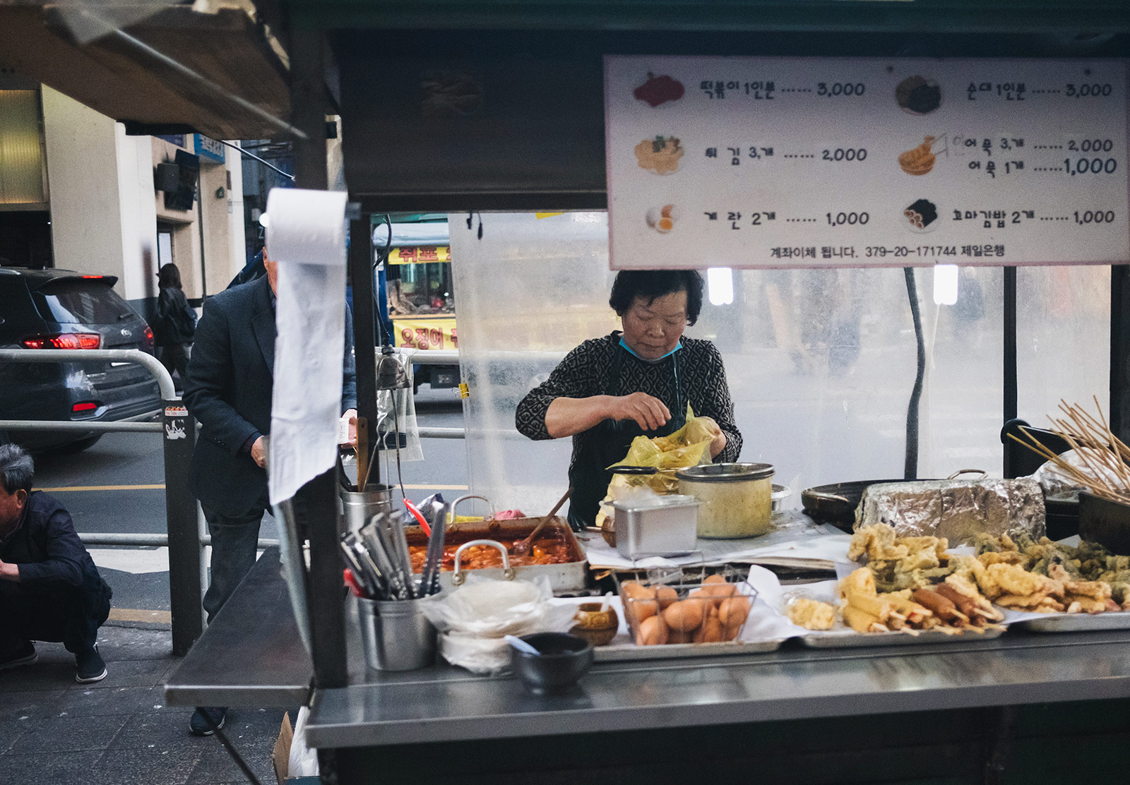 Woman preparing food on stand