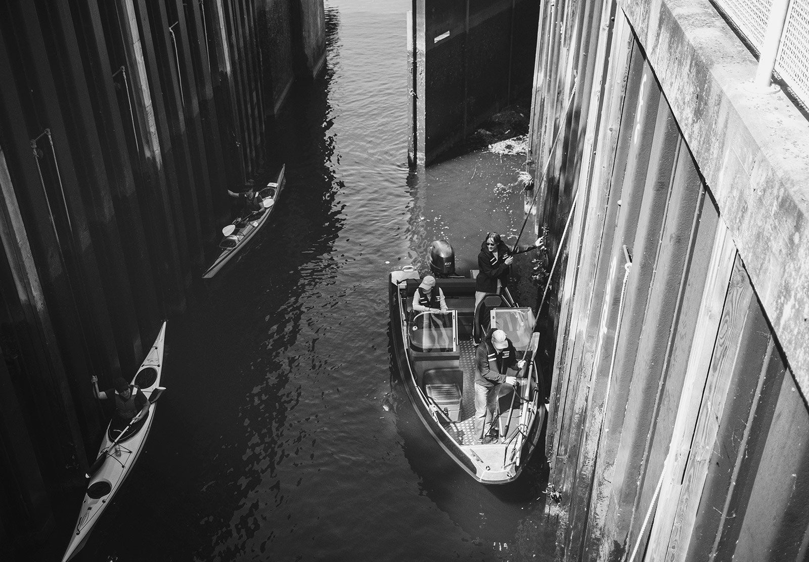 Boat and kayaks in lock