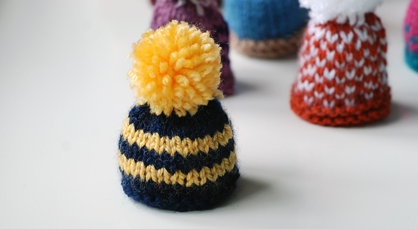 Blue and yellow stripe hat with bobble