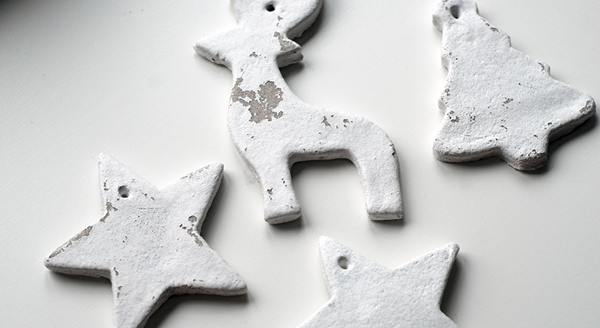 Christmas decorations painted white with peeling paint