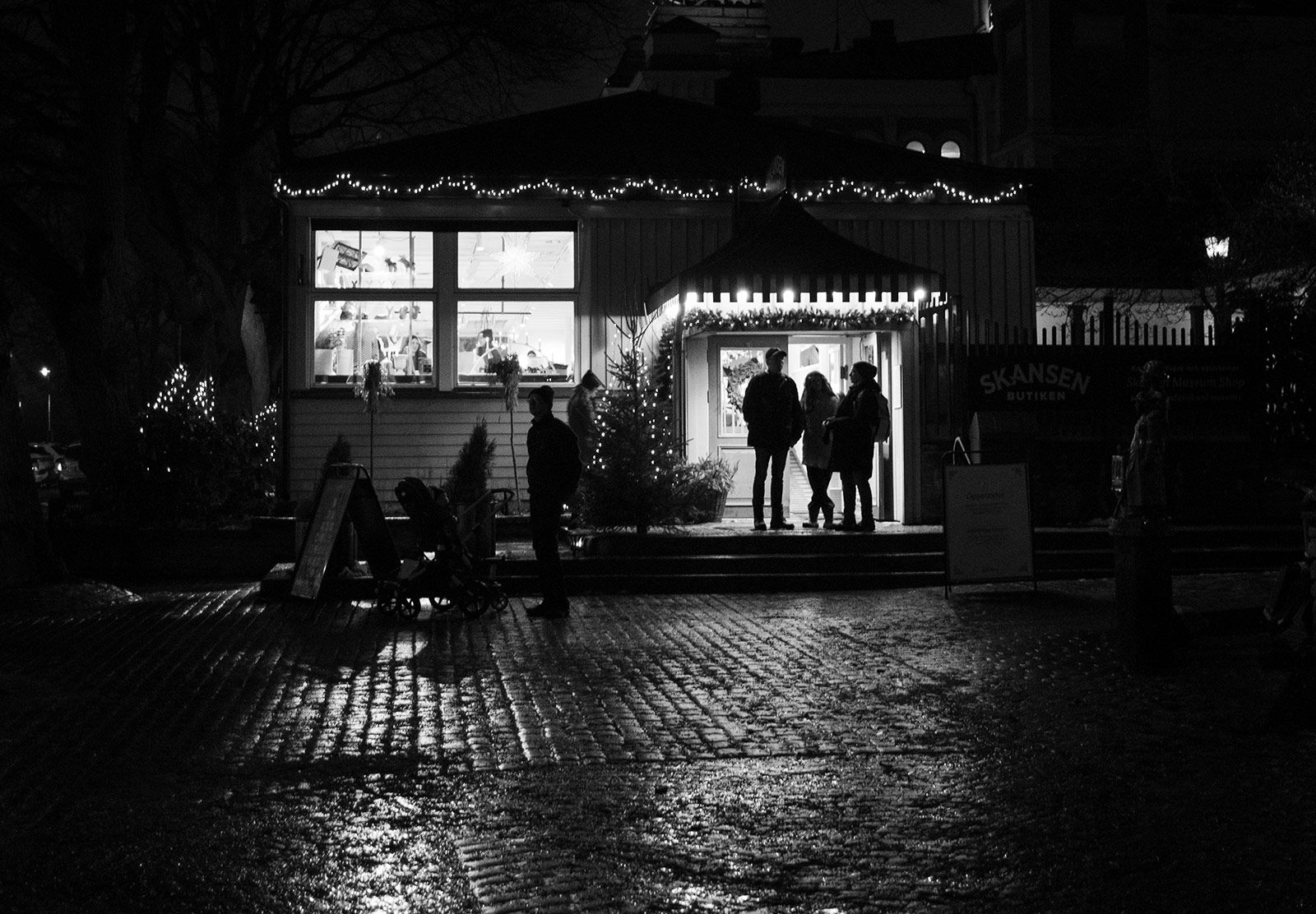 People stood in lit doorway