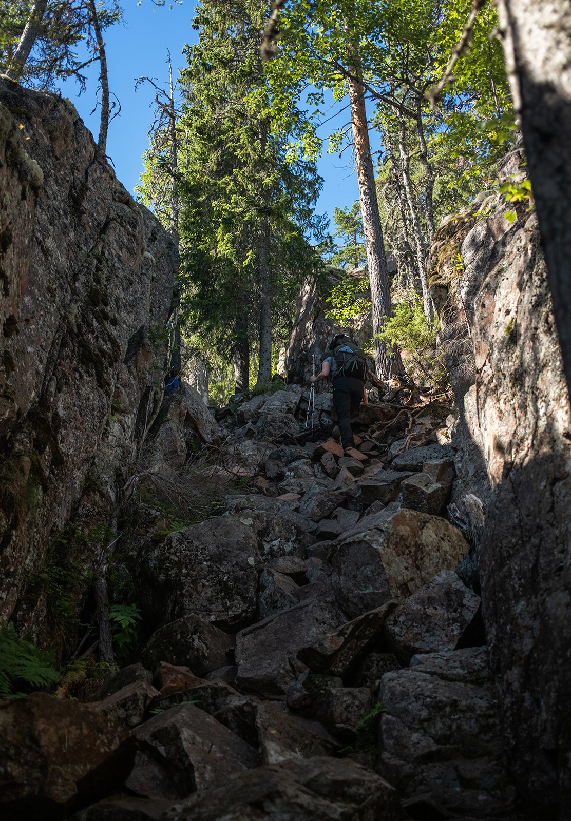 People hiking up rocks