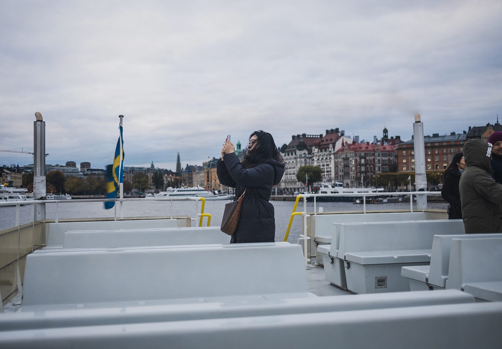 Woman on boat taking photo
