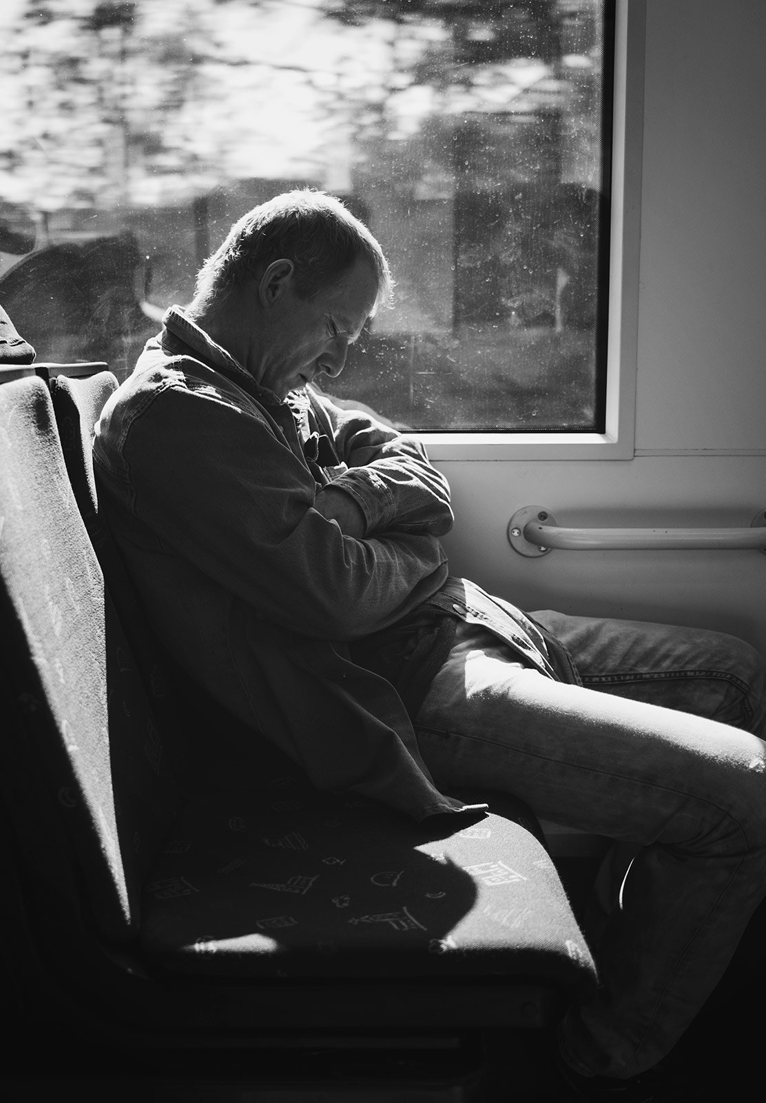 Man sleeping on a tram