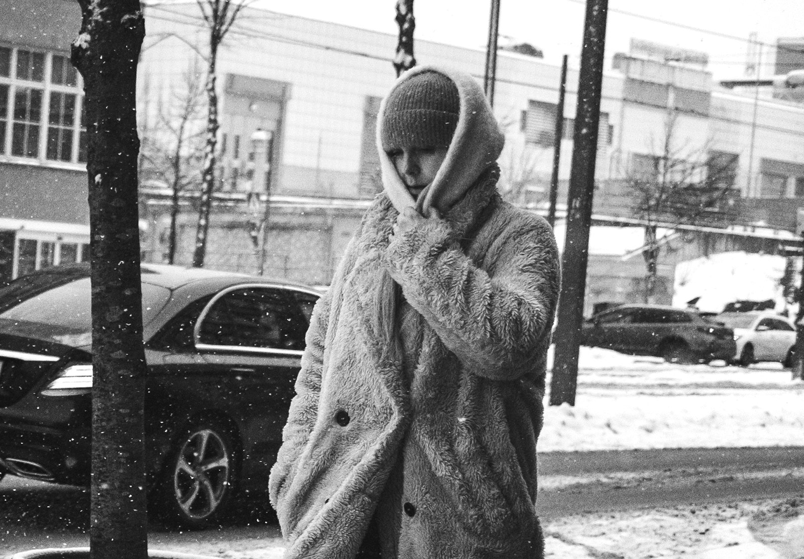 Woman walking with hood up