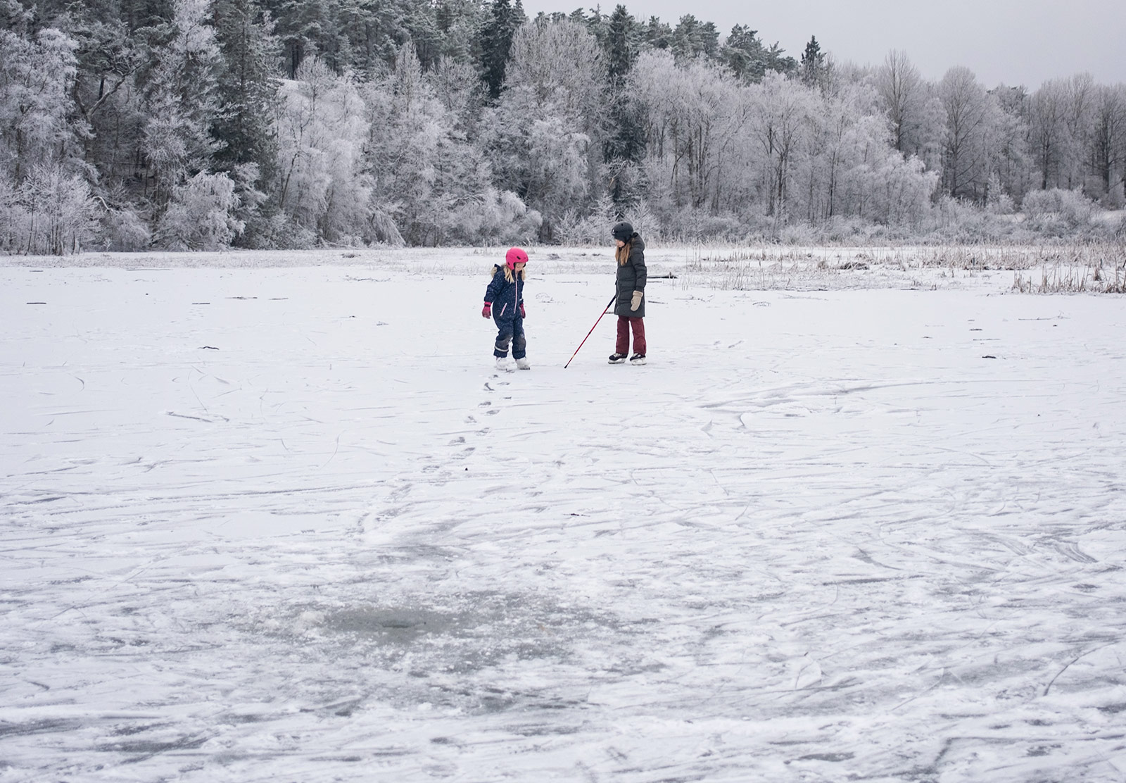 Two children on frozen lake
