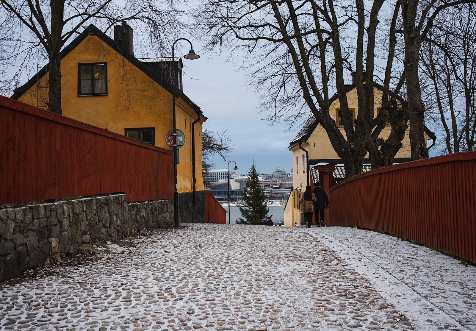 Snow on cobbled street