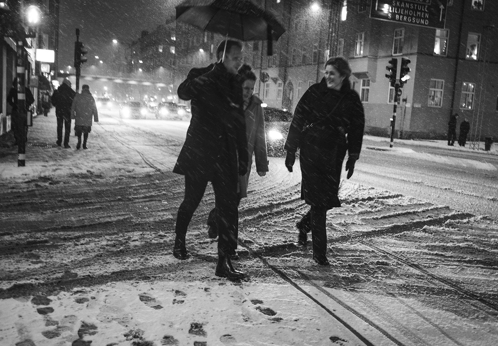 People walking under an umbrella