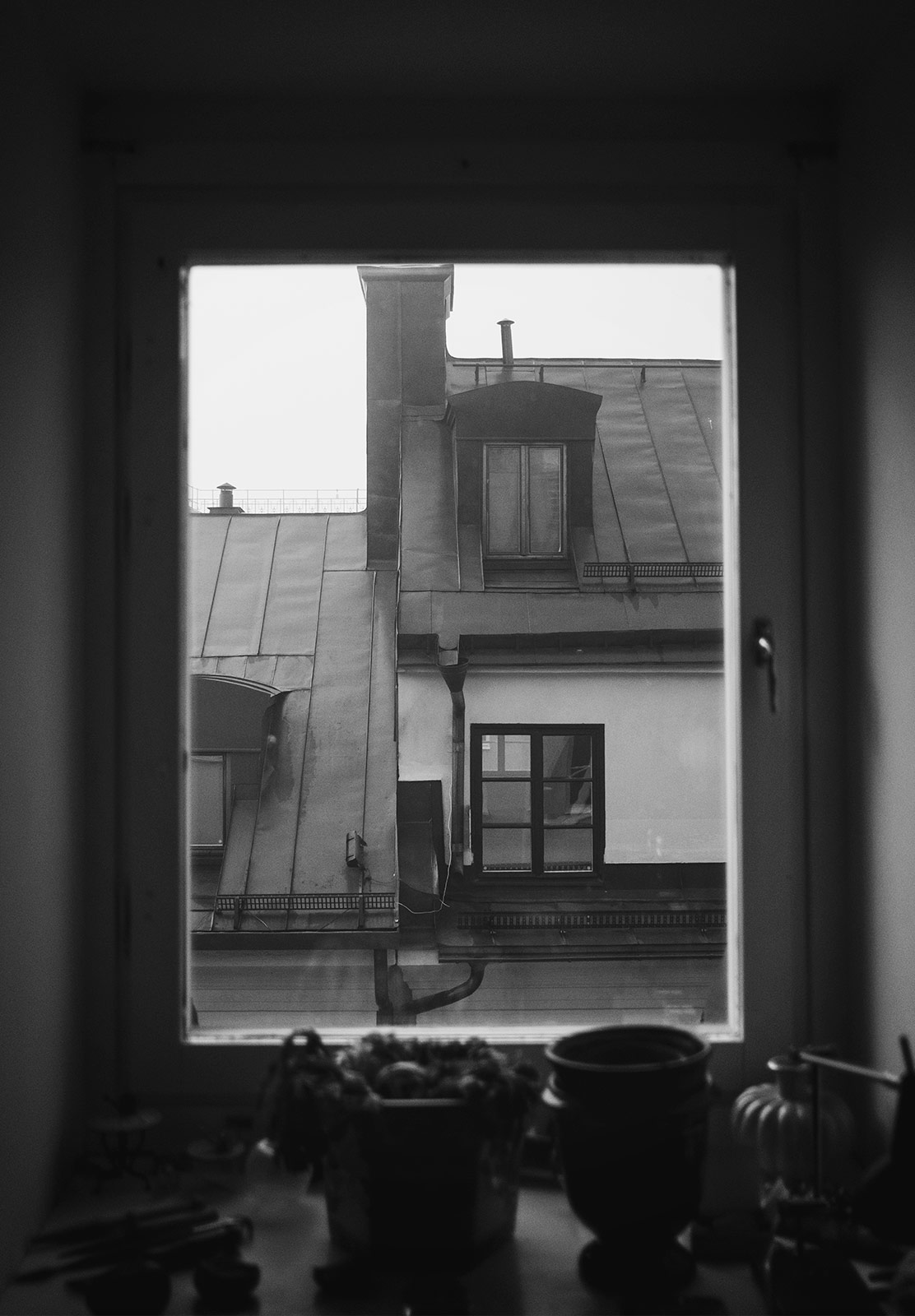 View of old buildings through window