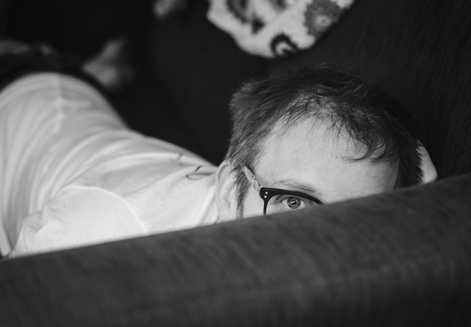 Peering over sofa