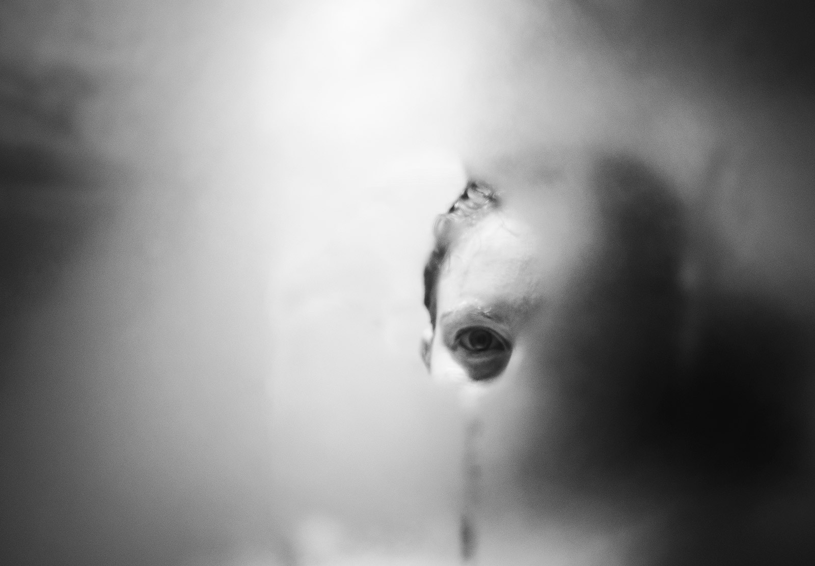 Eye in fogged mirror