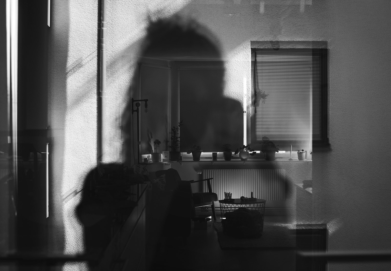 Silhouette in window