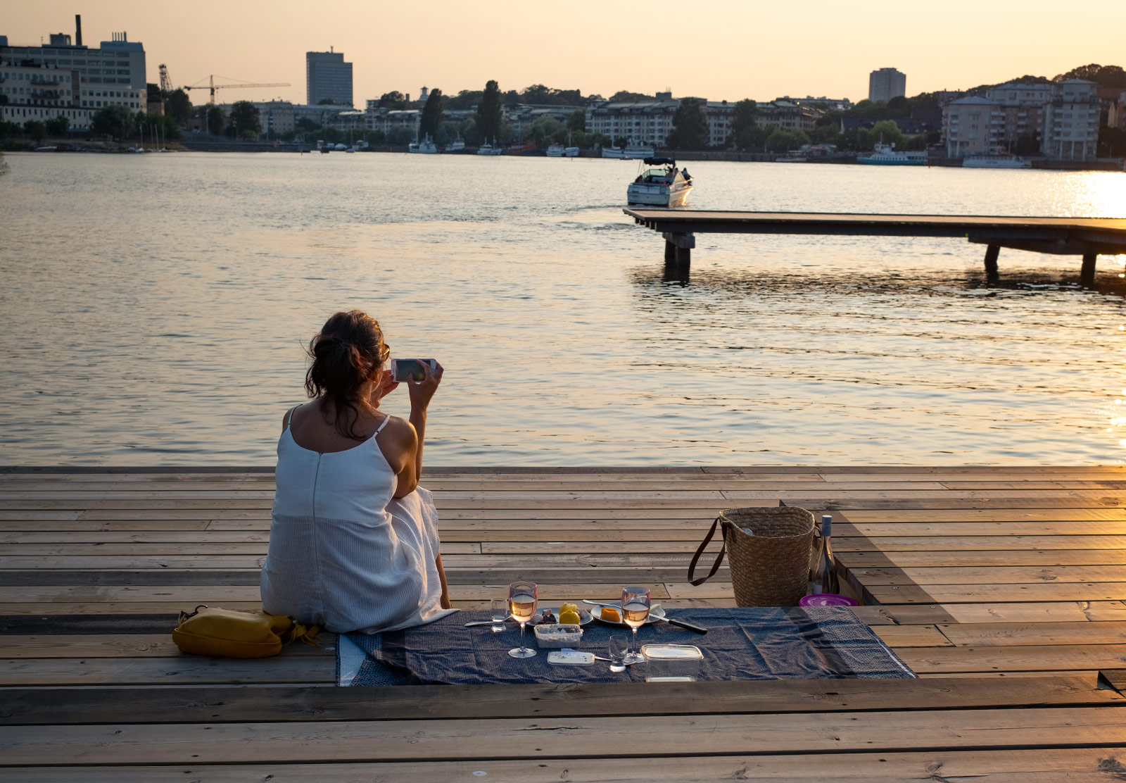 Woman photographing sunset