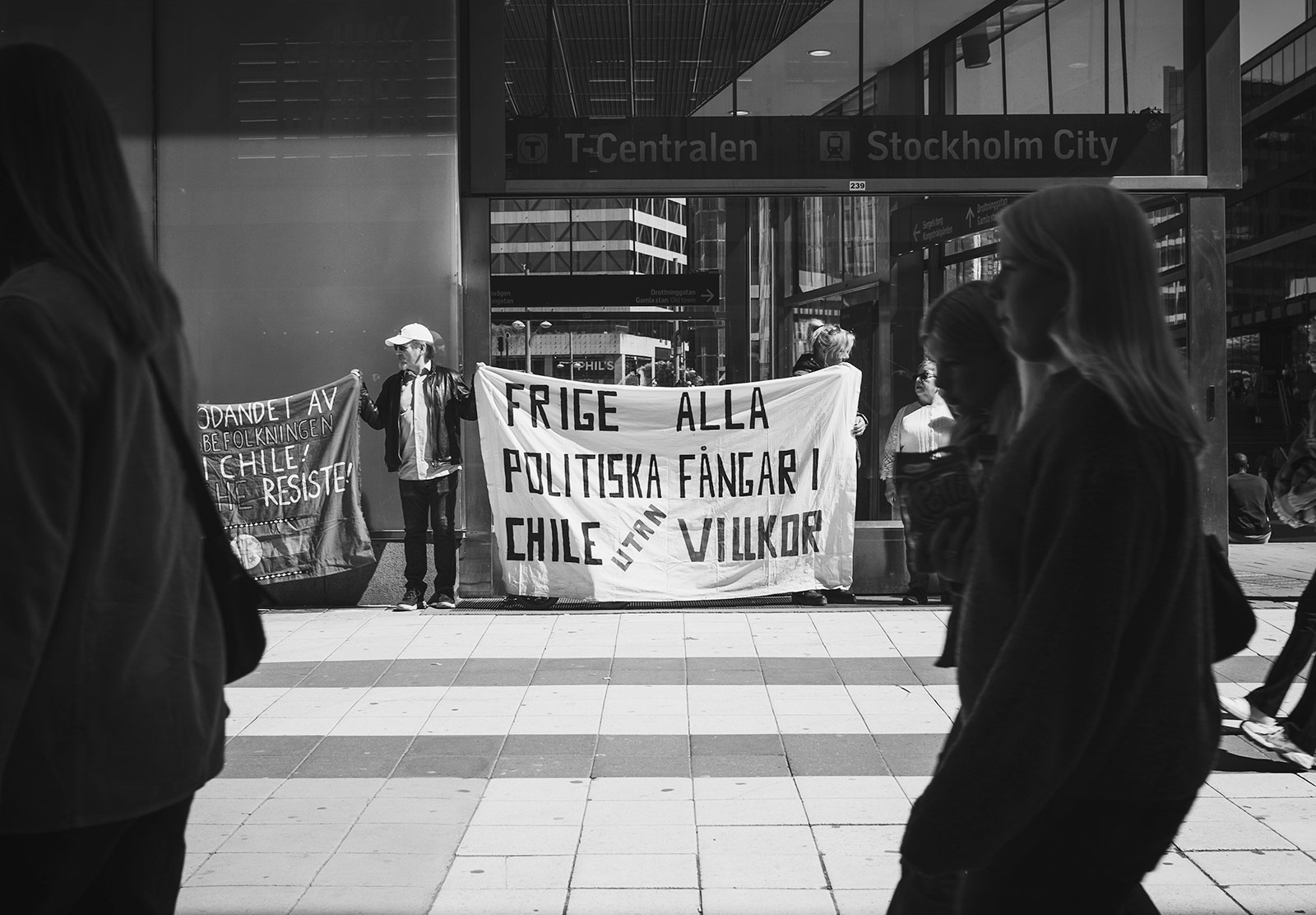 Man holding political message on sheet