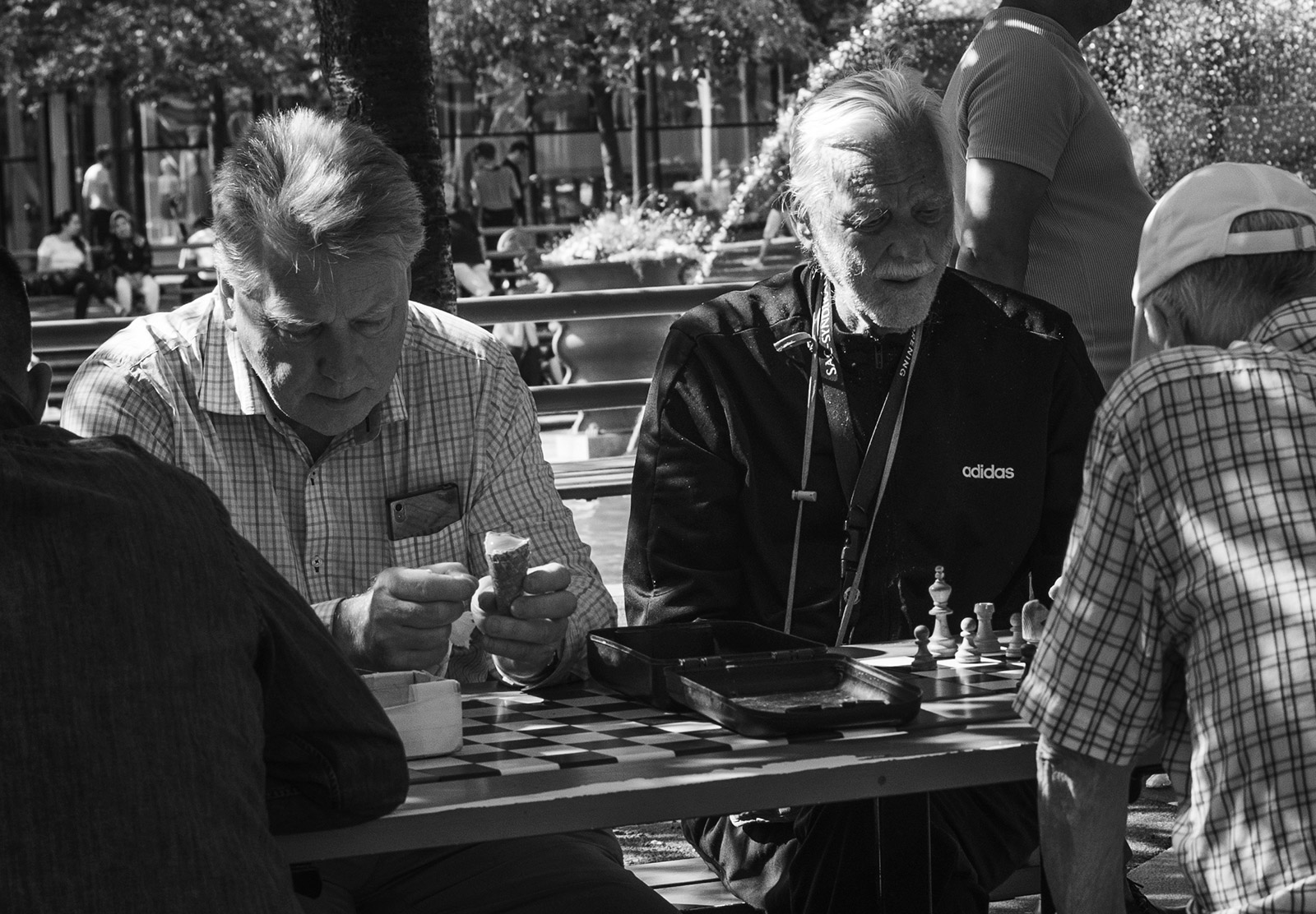 People sat at chess table