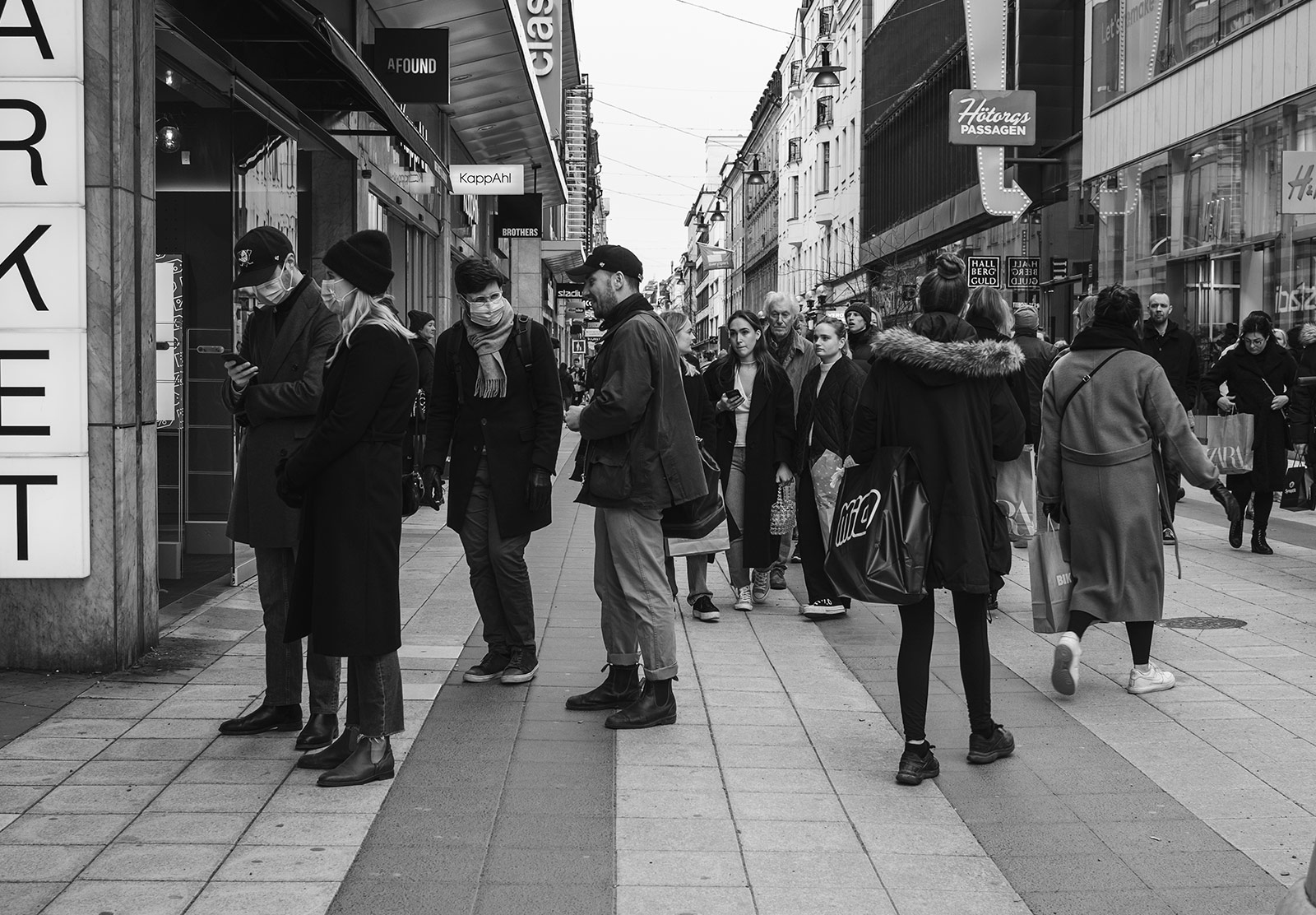 People queueing in masks