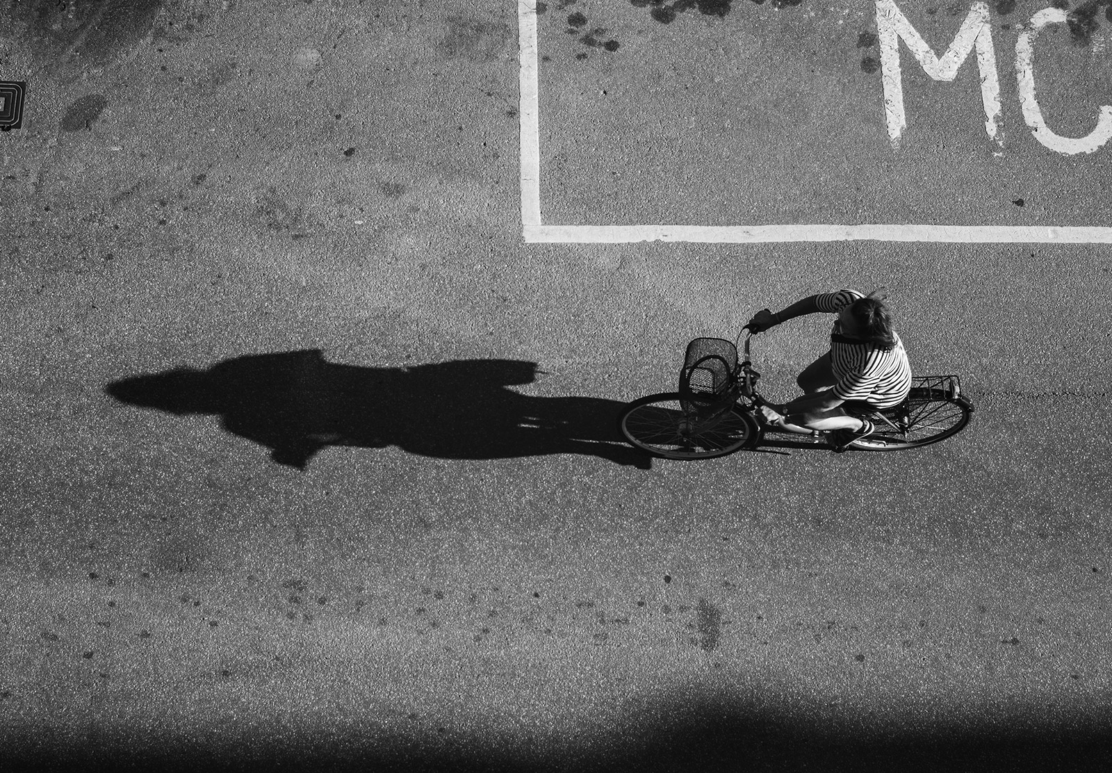 Cyclist with shadow