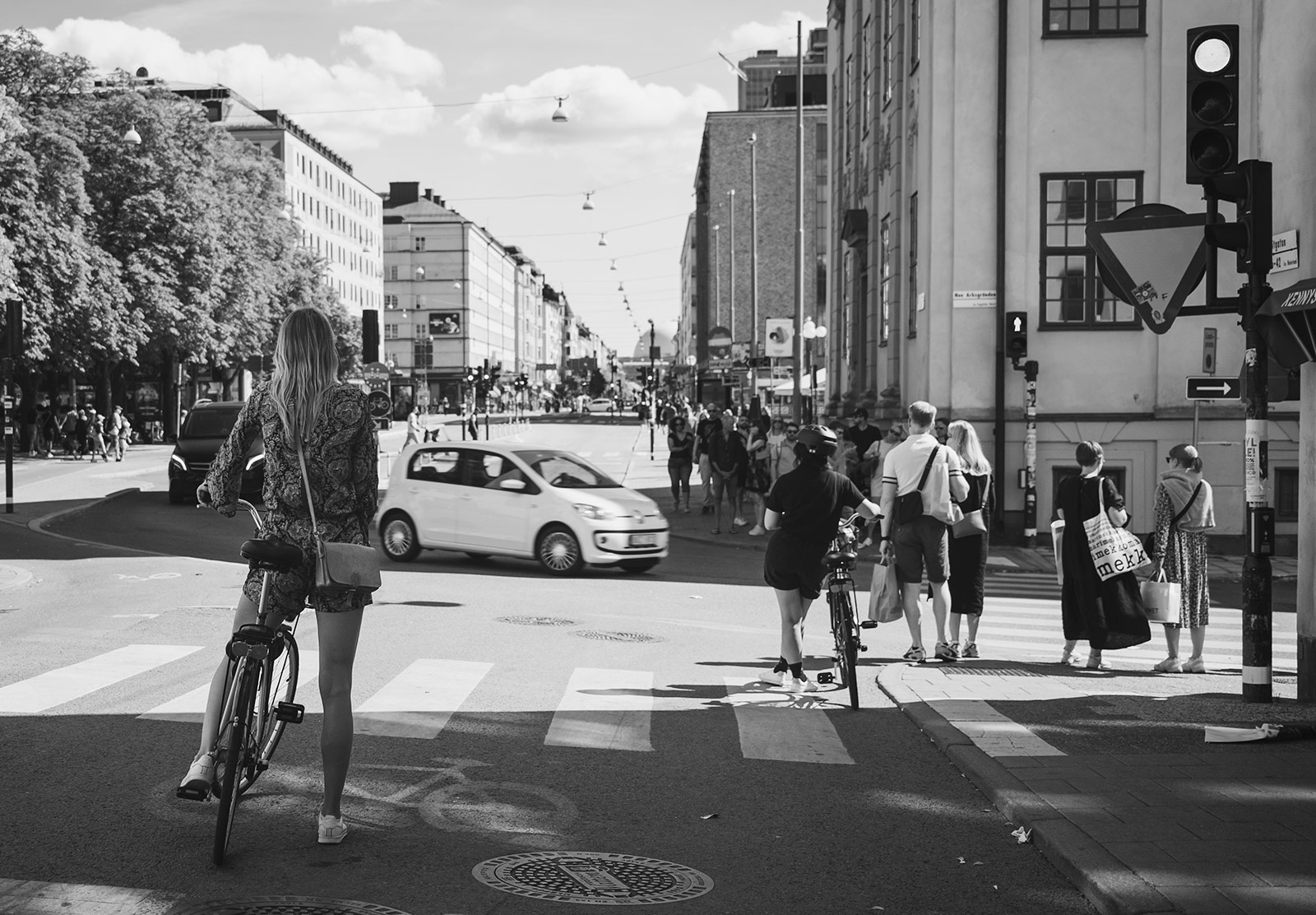 Cyclist waiting for car to pass