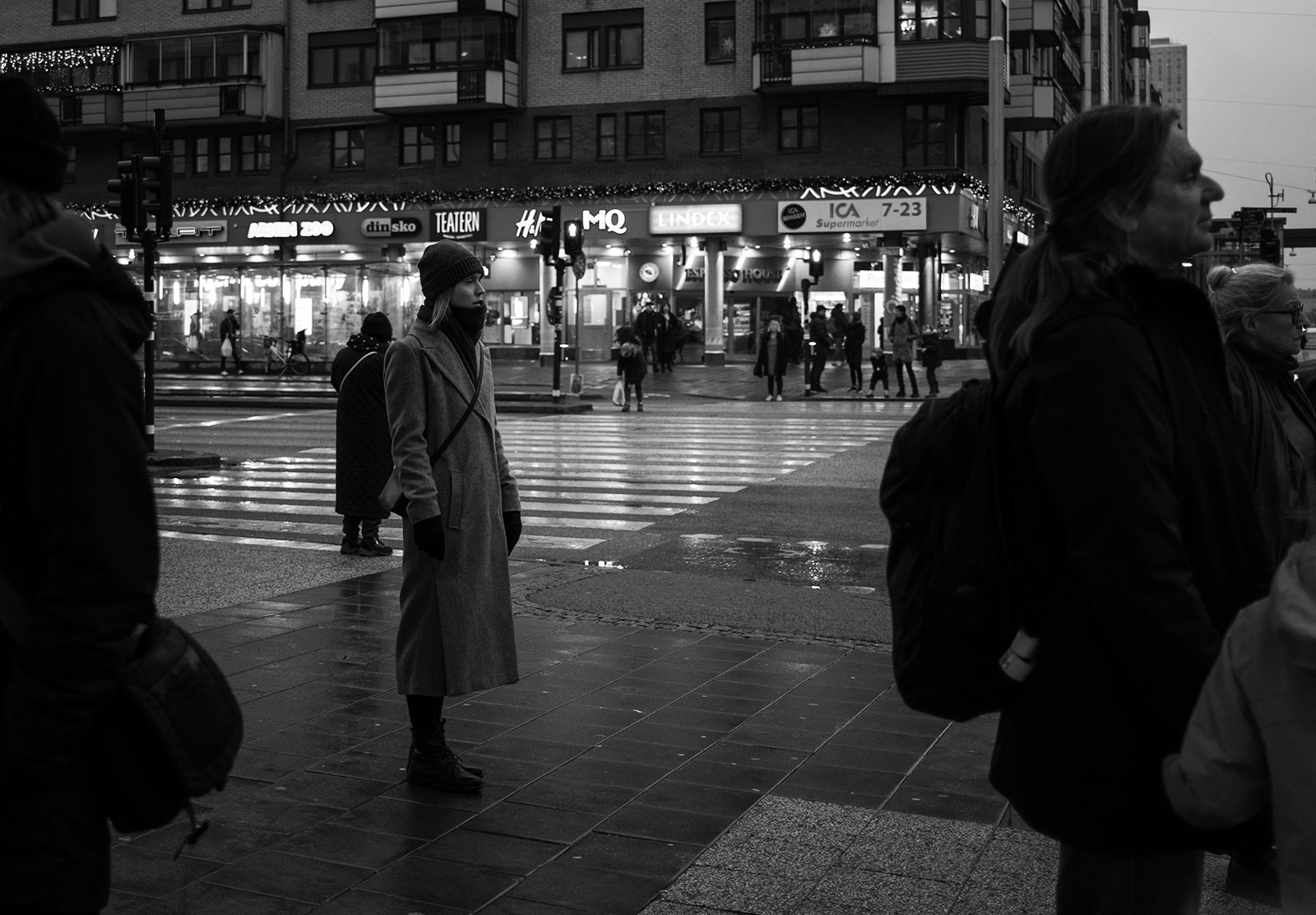 Woman standing on pavement