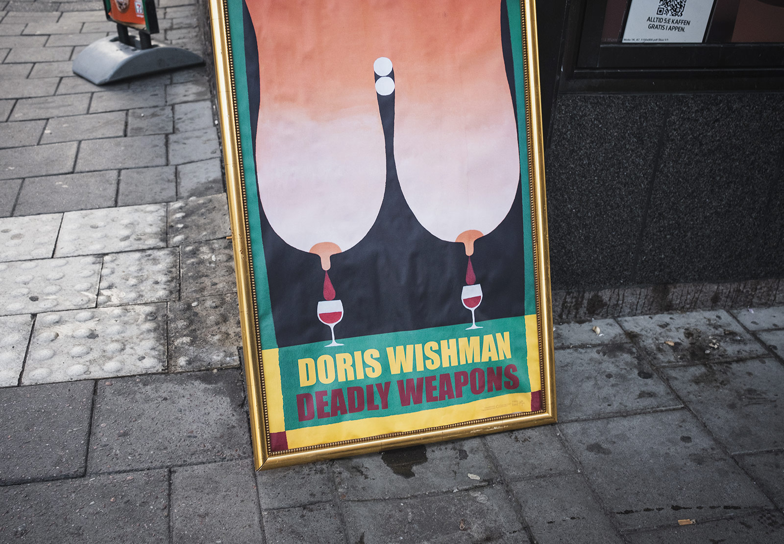 Sign with wine dripping out of breasts