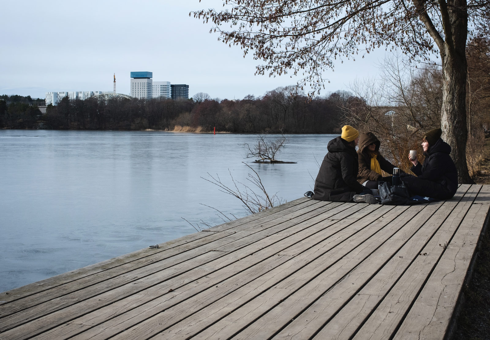 Women sat by the water