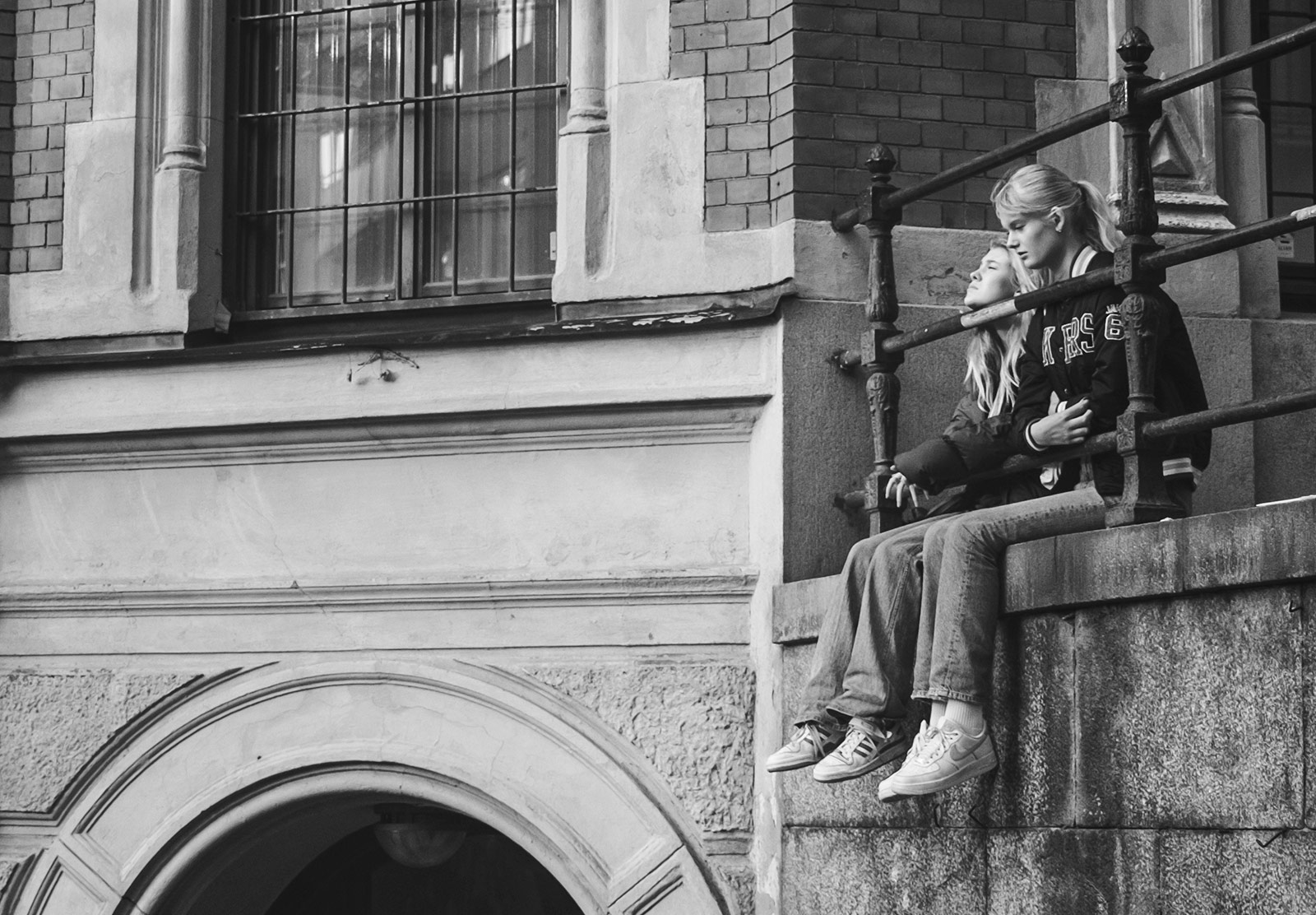 Girls sitting on ledge