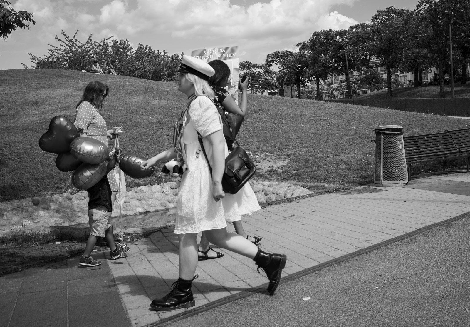 Woman in sailor hat and white dress