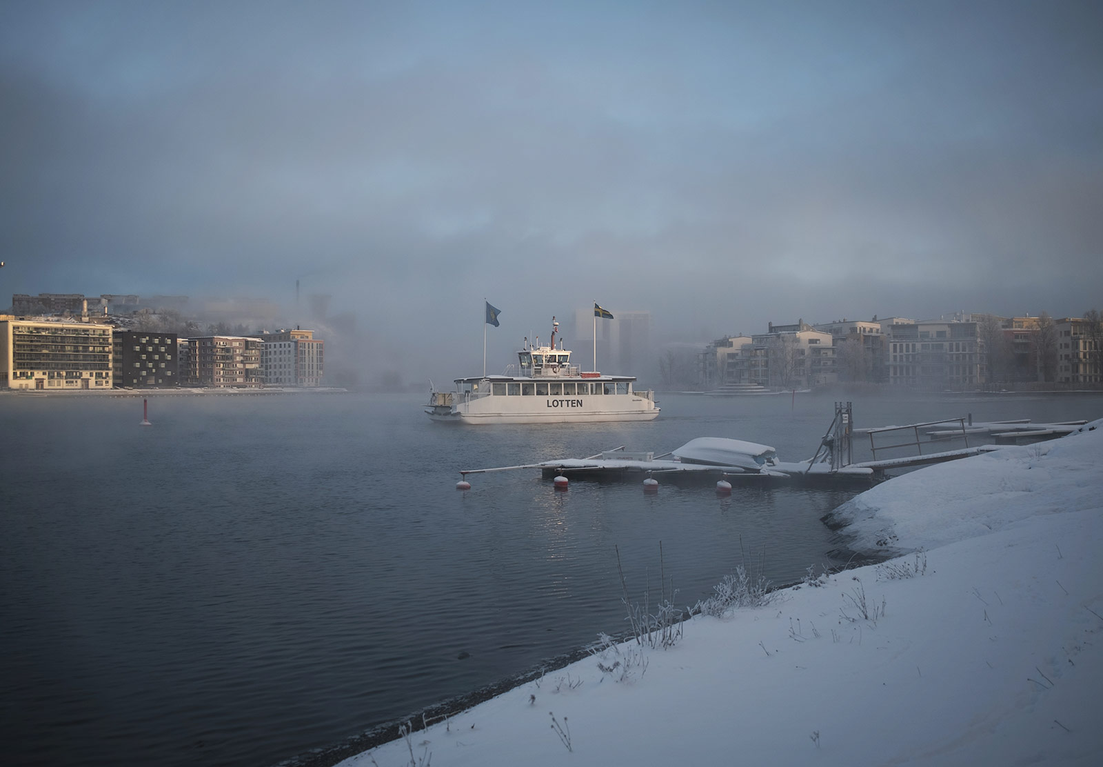 Boat moving through ice fog