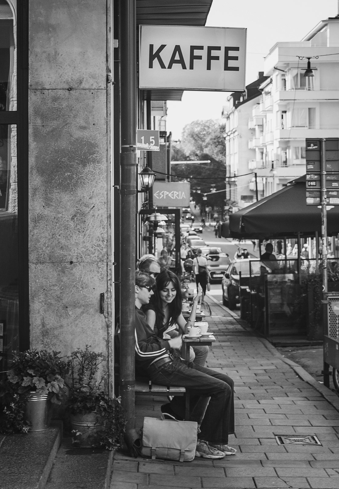 People drinking coffee on outdoor seats