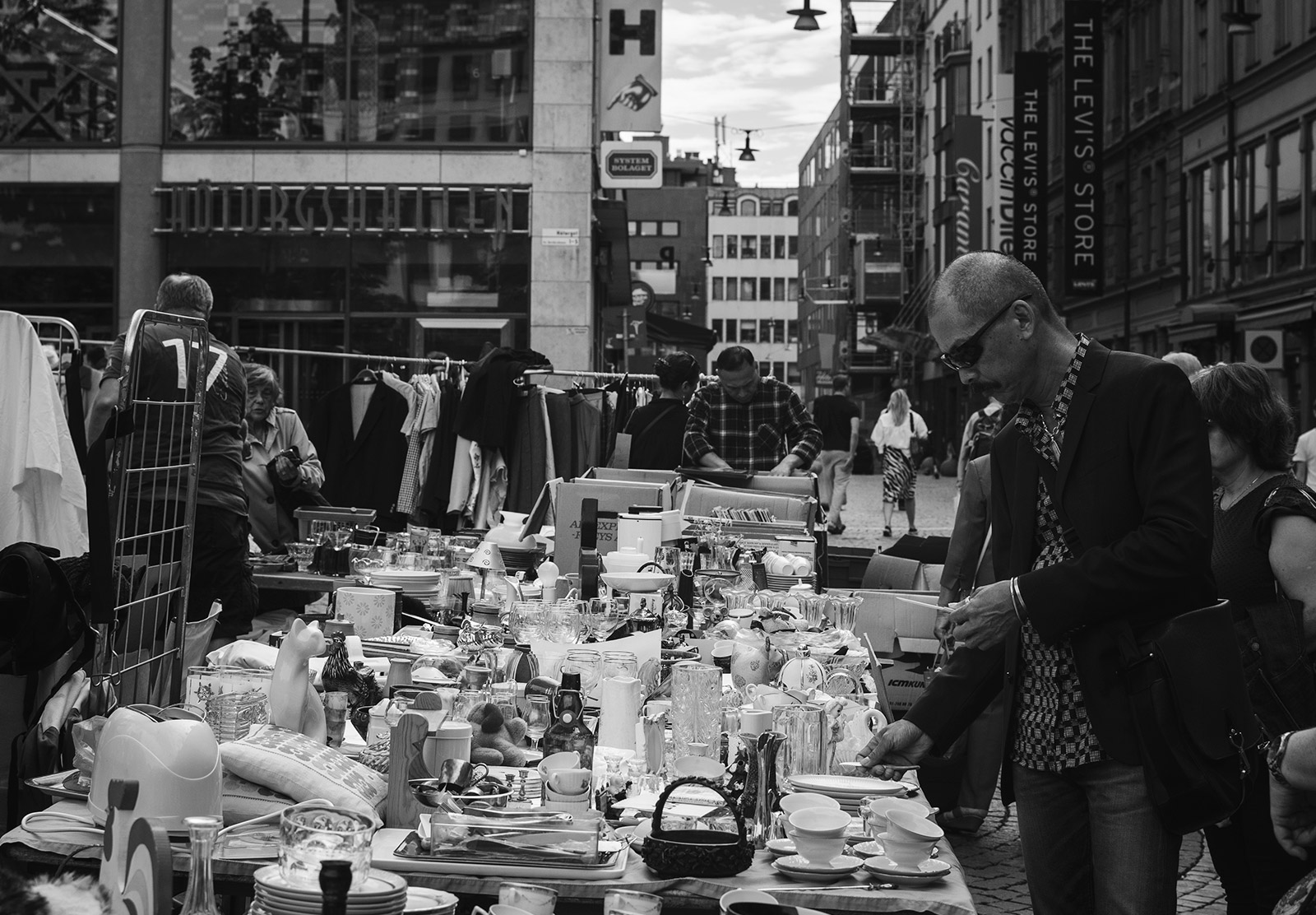 Man looking at a market stall